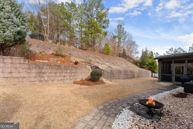 6514 Lemon Grass Ln, Flowery Branch, GA 30542 - view of yard with a fire pit and a sunroom