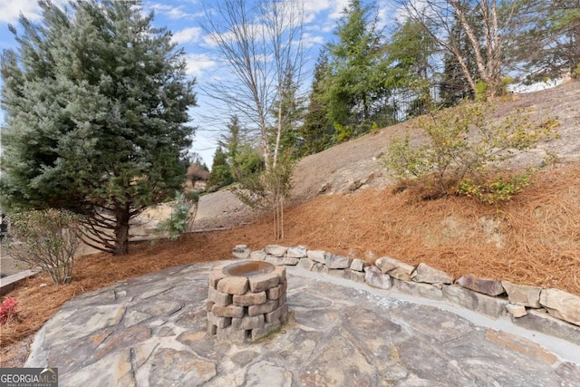 view of patio with a fire pit