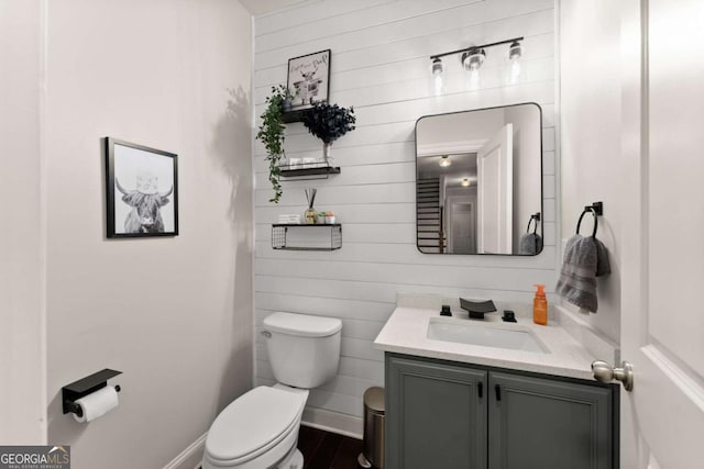 6514 Lemon Grass Ln, Flowery Branch, GA 30542 - bathroom featuring vanity and wood walls
