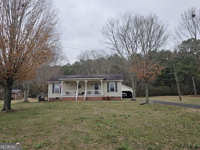 view of front of property with a porch, a carport, and a front lawn