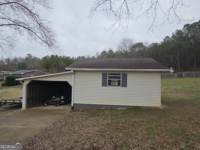 view of side of property featuring a carport