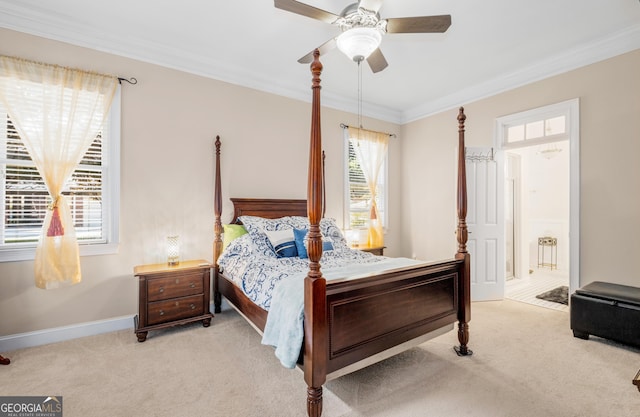 bedroom with carpet floors, ornamental molding, baseboards, and a ceiling fan