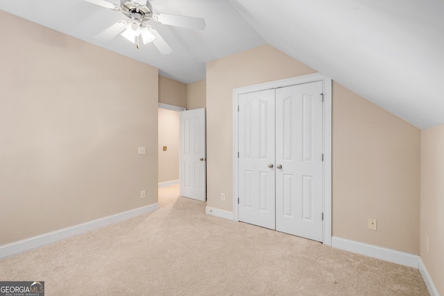 bonus room with carpet flooring, ceiling fan, baseboards, and lofted ceiling