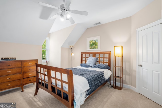 bedroom with carpet floors, a ceiling fan, and vaulted ceiling