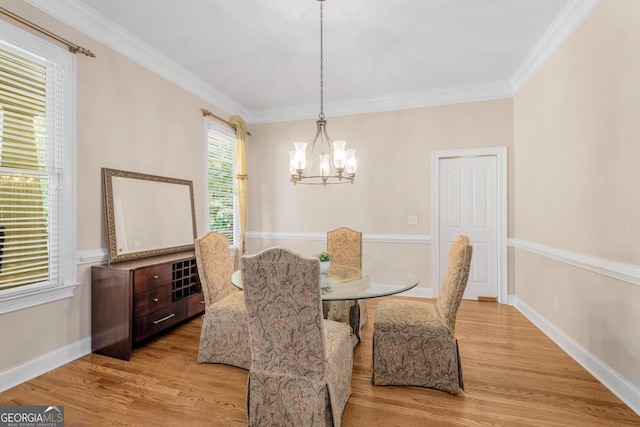 living area with a healthy amount of sunlight, a high ceiling, a stone fireplace, and wood finished floors