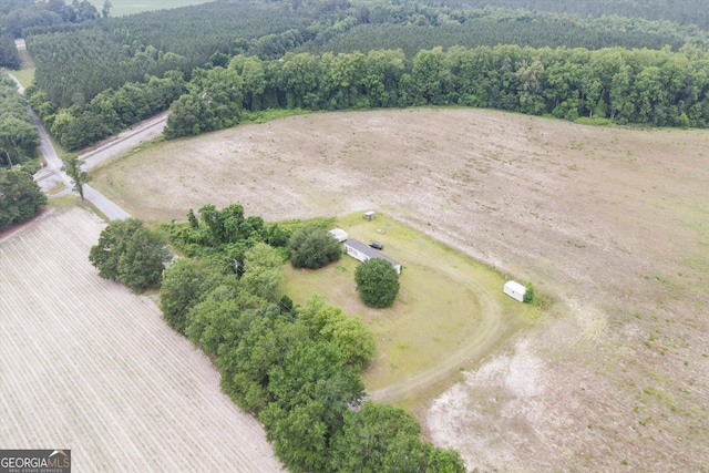 birds eye view of property featuring a rural view