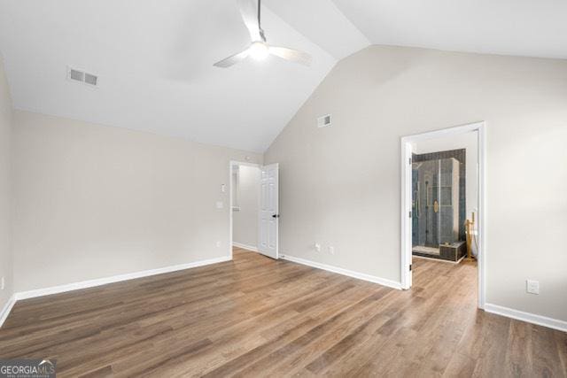 unfurnished room with lofted ceiling, hardwood / wood-style floors, and ceiling fan