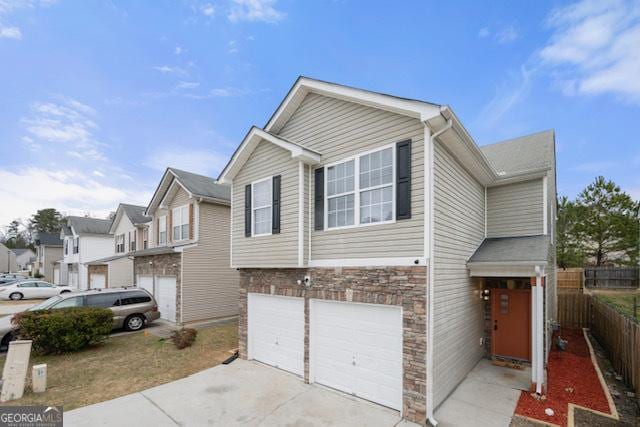 townhome / multi-family property featuring a garage