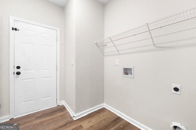 laundry area featuring electric dryer hookup, hardwood / wood-style floors, and hookup for a washing machine