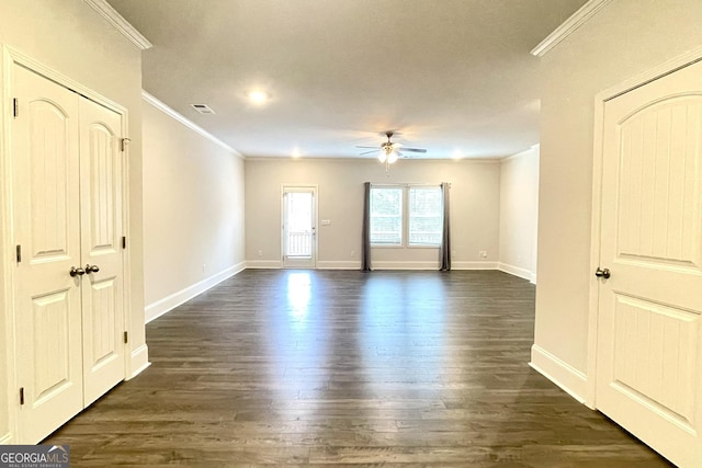 spare room with ornamental molding, dark hardwood / wood-style floors, and ceiling fan