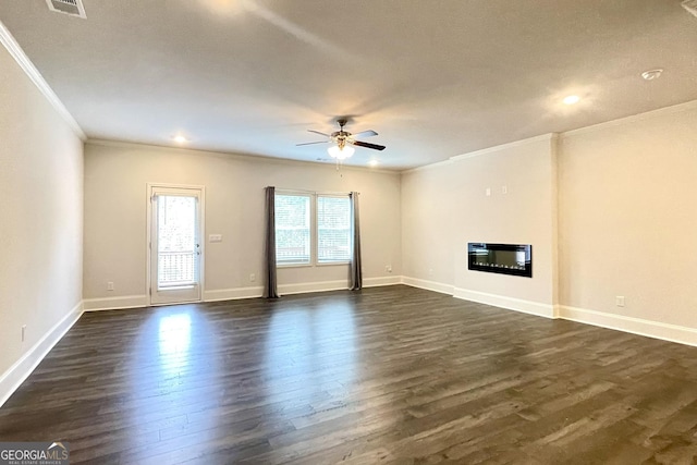 unfurnished living room featuring dark hardwood / wood-style flooring, ornamental molding, and ceiling fan