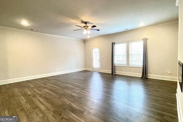 spare room featuring crown molding, ceiling fan, and dark hardwood / wood-style floors