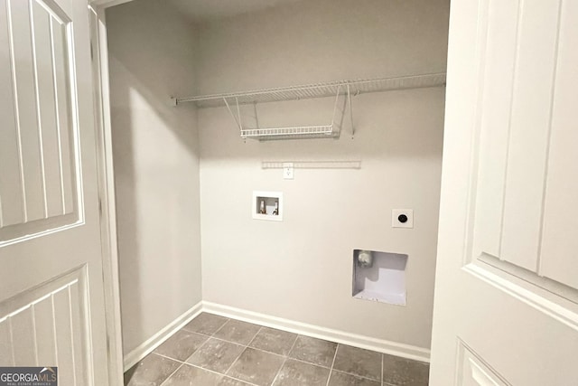 washroom with hookup for a washing machine, dark tile patterned floors, and hookup for an electric dryer