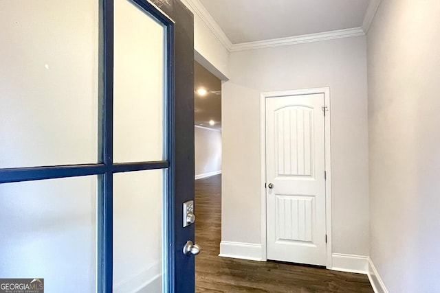 hall with crown molding and dark hardwood / wood-style flooring