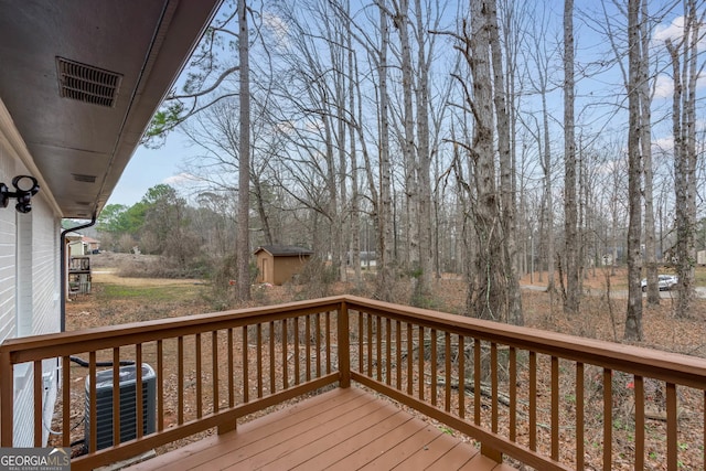 wooden terrace with central AC unit