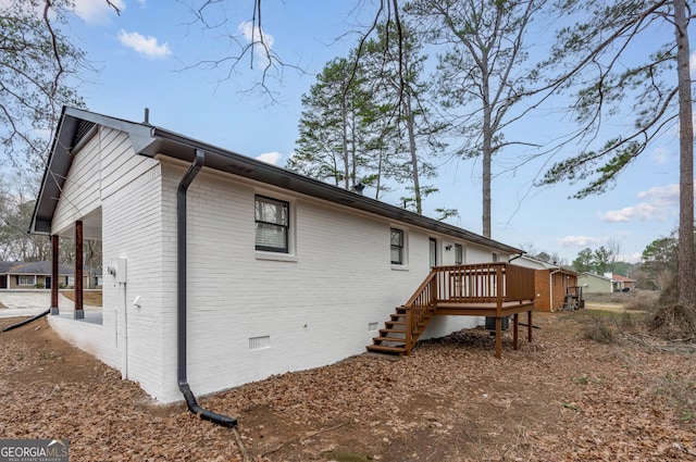 rear view of house featuring a wooden deck and cooling unit