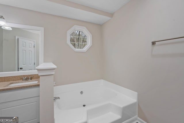 bathroom featuring vanity and a bathtub