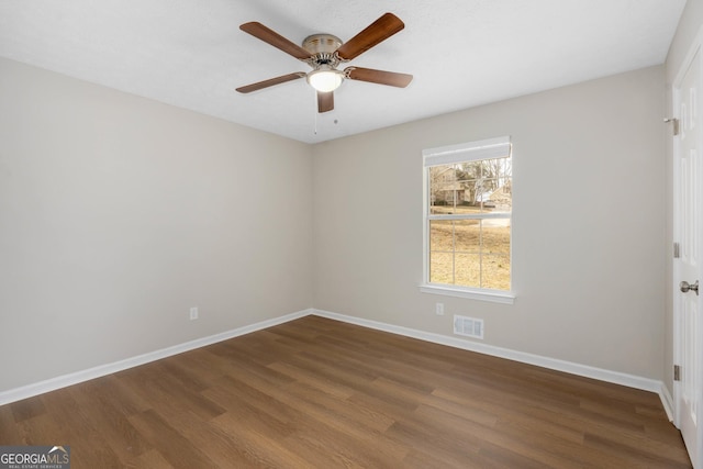 unfurnished room with hardwood / wood-style flooring and ceiling fan