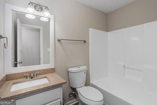 full bathroom featuring shower / bathtub combination, vanity, toilet, and a textured ceiling