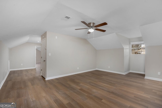 bonus room featuring vaulted ceiling, ceiling fan, and dark hardwood / wood-style flooring