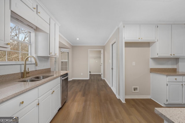 kitchen featuring sink, hardwood / wood-style flooring, dishwasher, and white cabinets