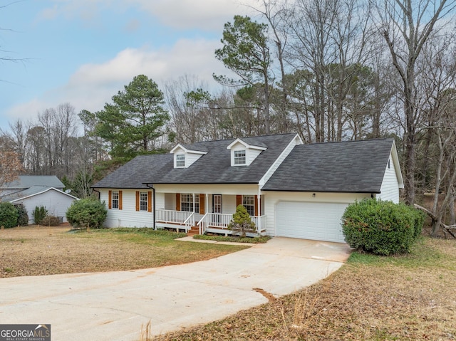 cape cod home with a porch, a garage, and a front yard