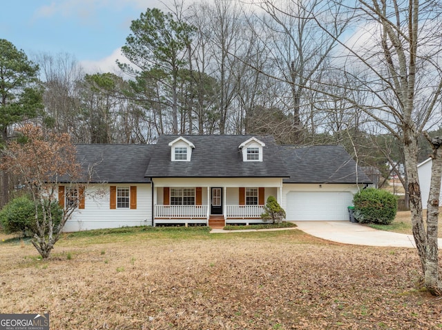 cape cod-style house with a porch, a garage, and a front lawn