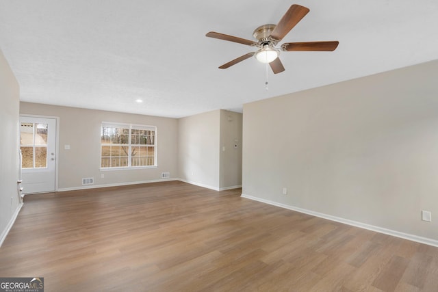 unfurnished room featuring ceiling fan and light hardwood / wood-style floors