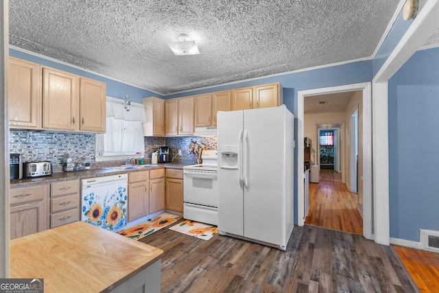 kitchen with light brown cabinetry, white appliances, dark wood-type flooring, and decorative backsplash