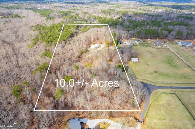 birds eye view of property with a rural view