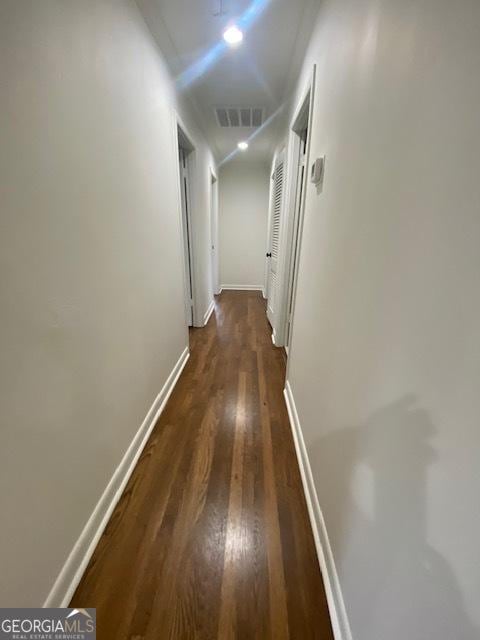 hall with dark hardwood / wood-style flooring