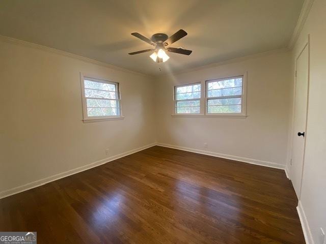 unfurnished room featuring crown molding, dark hardwood / wood-style floors, and ceiling fan