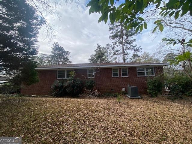 rear view of house with cooling unit