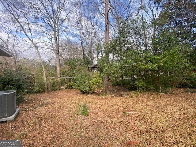 view of yard with central AC