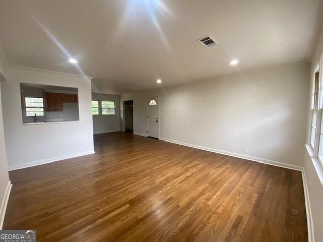 spare room featuring dark hardwood / wood-style floors