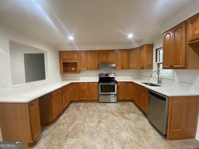 kitchen featuring appliances with stainless steel finishes and sink