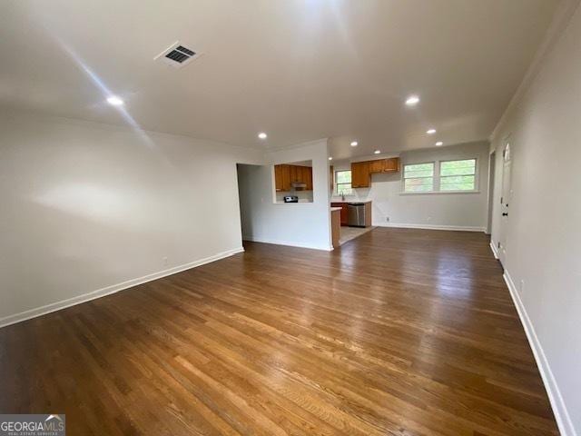 unfurnished living room with dark wood-type flooring