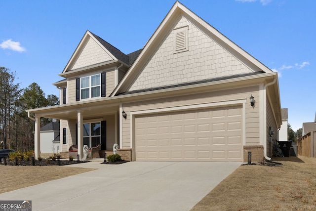 view of front of home with brick siding, a porch, and concrete driveway