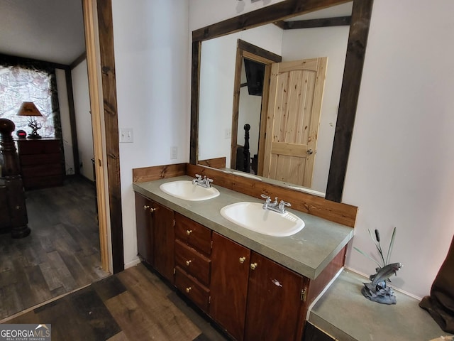 bathroom with vanity and hardwood / wood-style floors