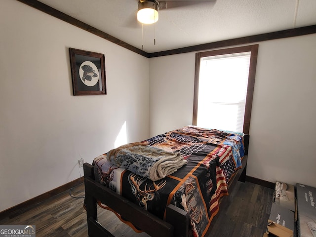 bedroom featuring dark hardwood / wood-style floors and ceiling fan