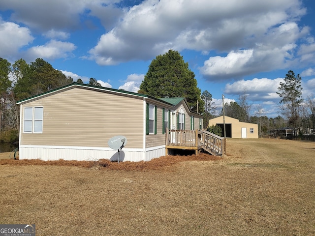 view of side of property featuring a yard