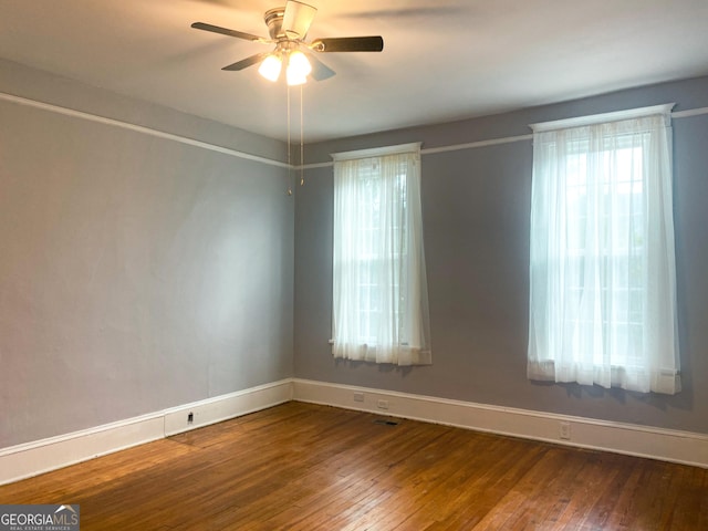 empty room with wood-type flooring and ceiling fan