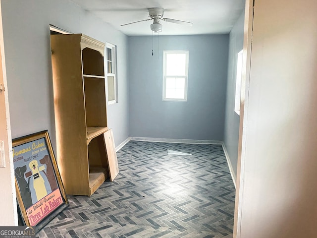 interior space featuring ceiling fan