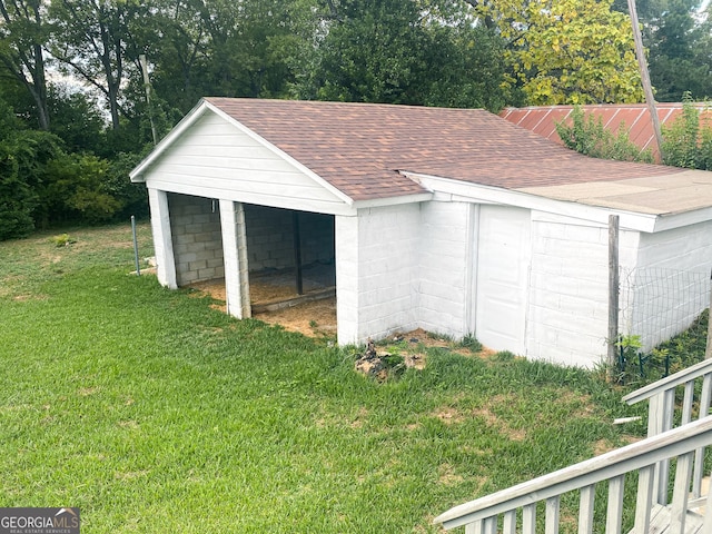 garage with a yard