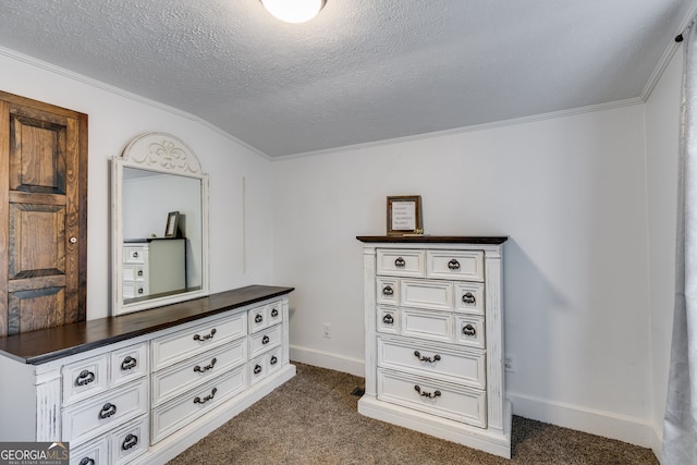 hallway with crown molding, dark carpet, and a textured ceiling