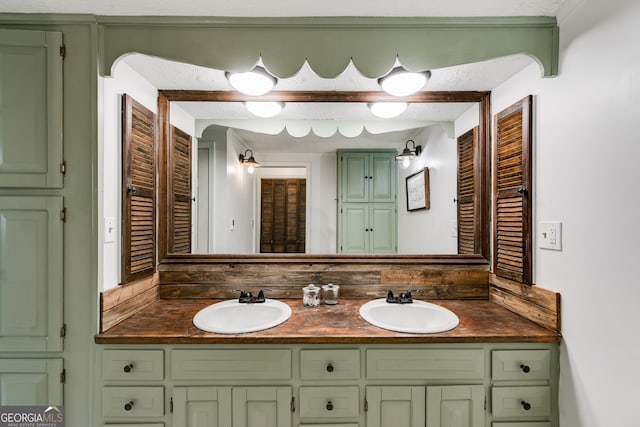 bathroom with vanity and a textured ceiling