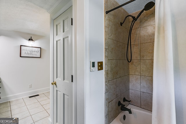 bathroom featuring tile patterned flooring, a textured ceiling, and shower / bath combo with shower curtain