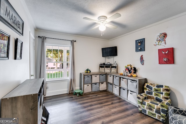 interior space with dark hardwood / wood-style flooring, ceiling fan, ornamental molding, and a textured ceiling