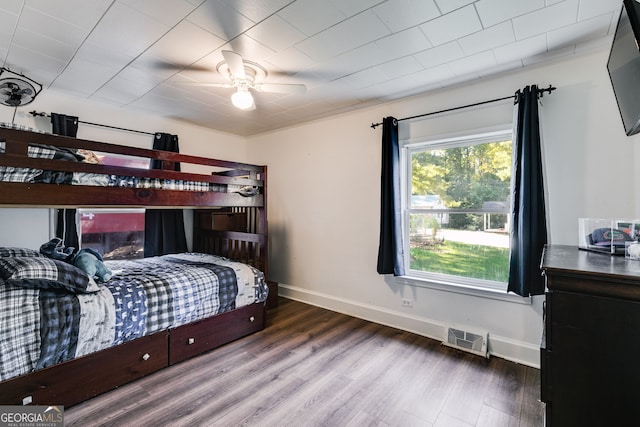 bedroom with wood-type flooring and ceiling fan