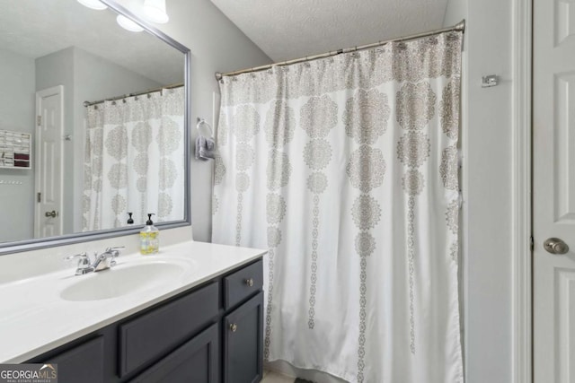 bathroom featuring vanity and a textured ceiling